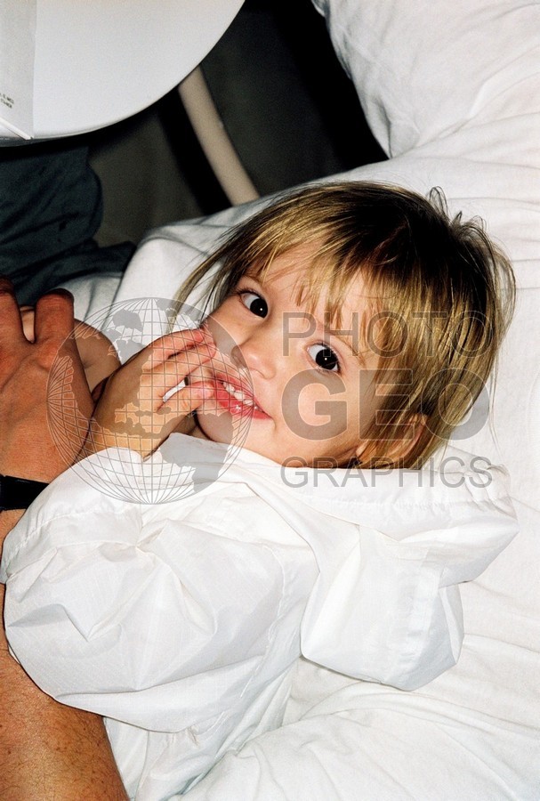 5198 Baby in White Raincoat