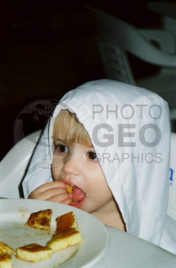 5199 Eating Baby in White Raincoat