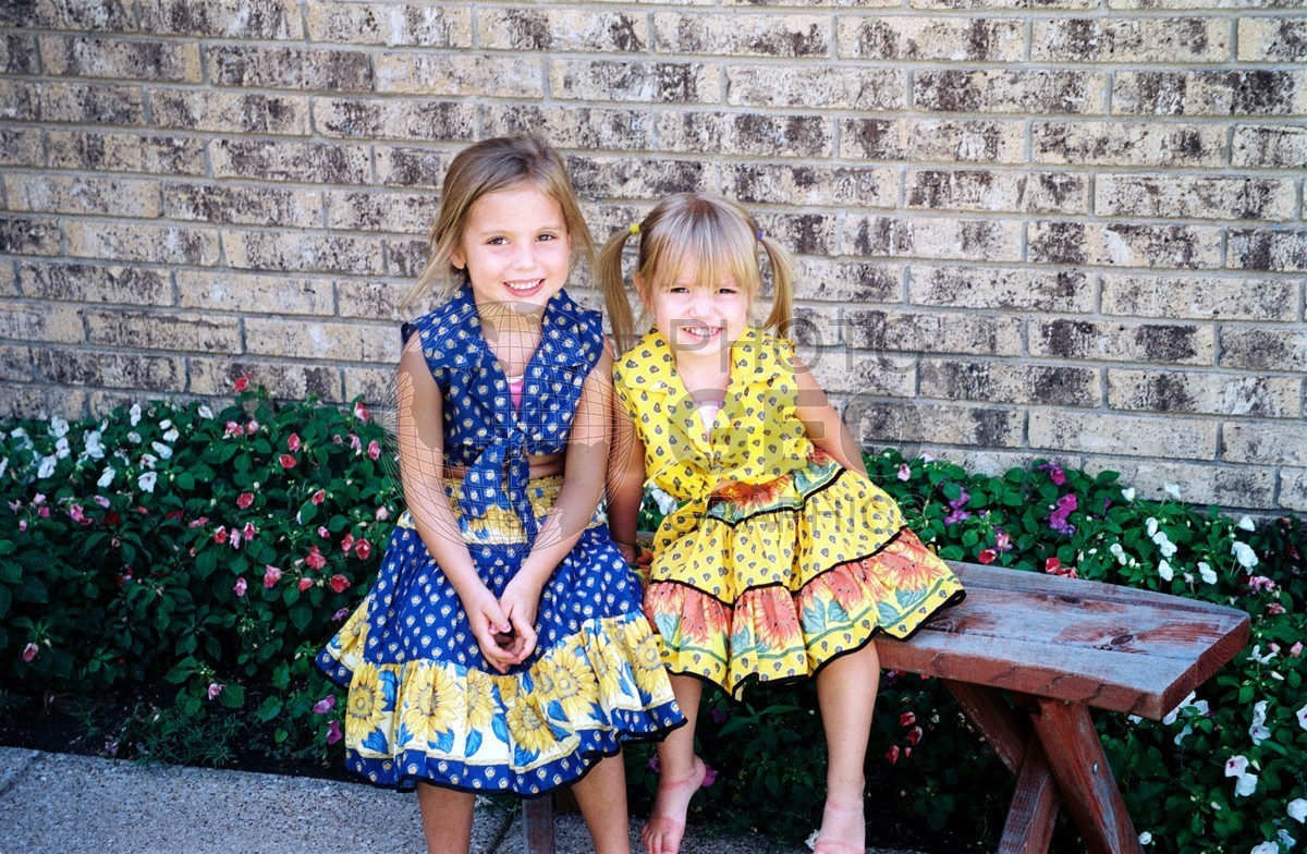 5205 Girls in Yellow & Blue Dresses