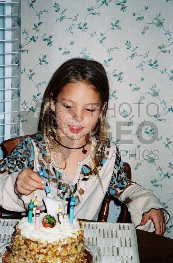 5246 Girl Placing Birthday Candles