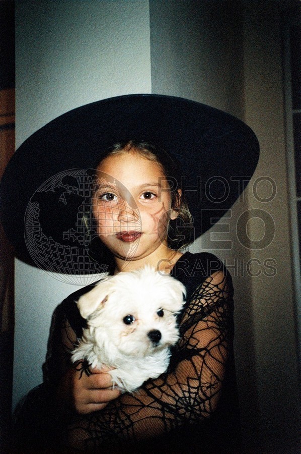 5248 Girl Dressed as Witch Holding Puppy